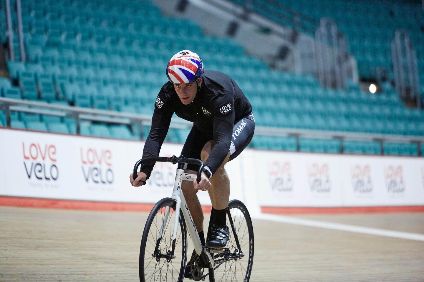 Cyclist riding on the track in the Manchester velodrome