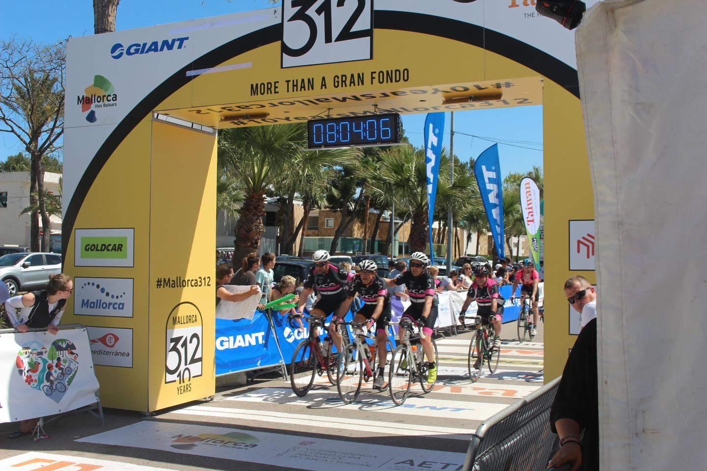 Cyclists crossing the finish line of the Mallorca 312 event.