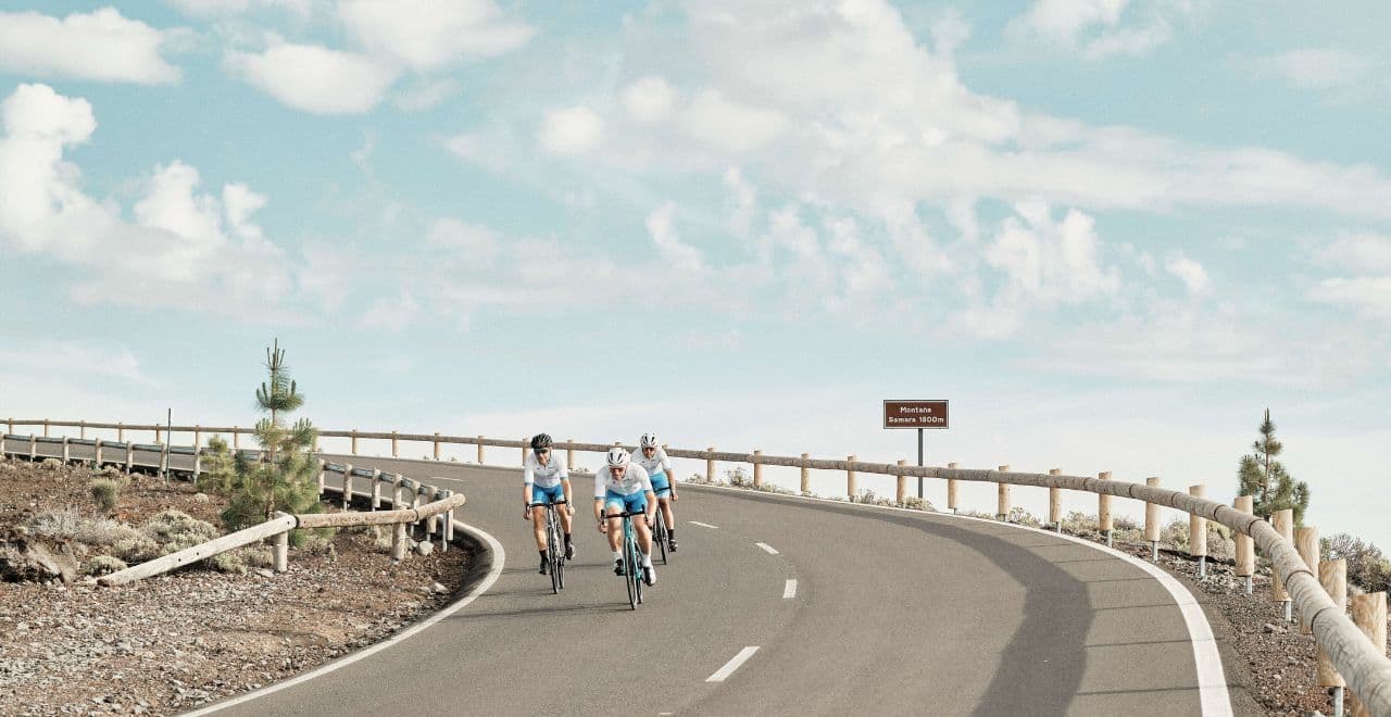 Cyclists enjoying a coastal view in Tenerife, overlooking the expansive ocean under a cloudy sky