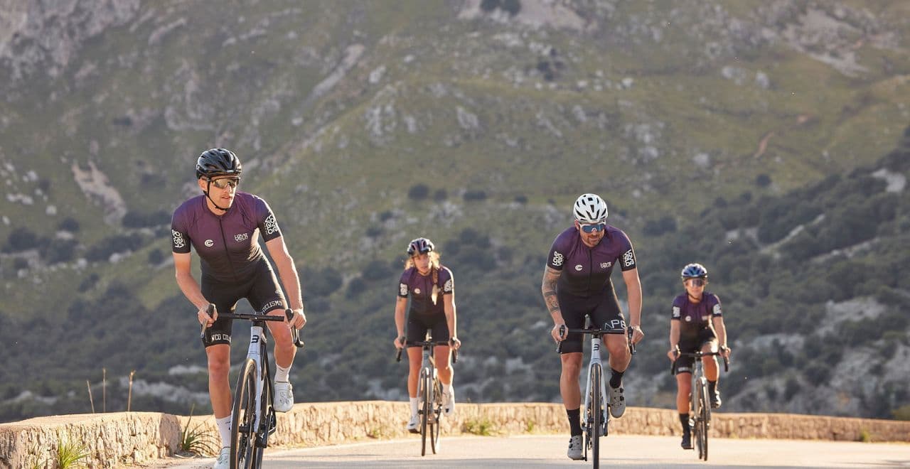 Cyclists riding uphill on a mountain road