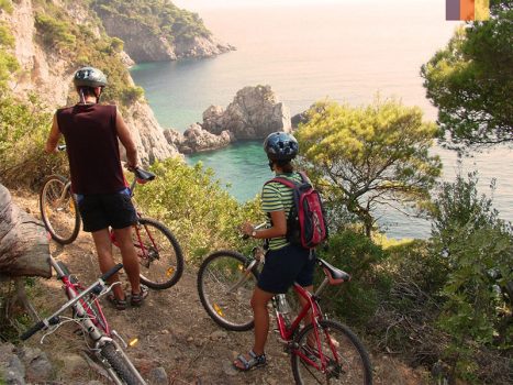 Cyclists ride along the coast of Dubrovnik
