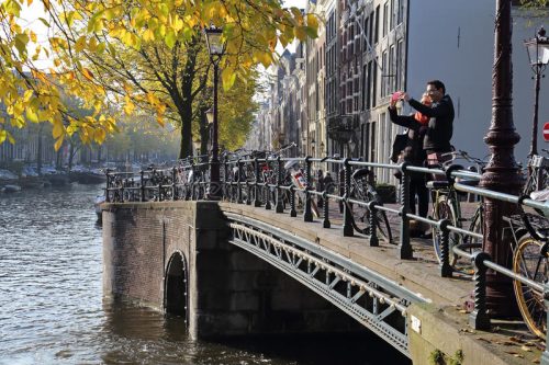 Couple taking a picture of Amsterdam 