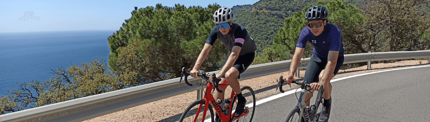 2 cyclists riding on the roads of Girona