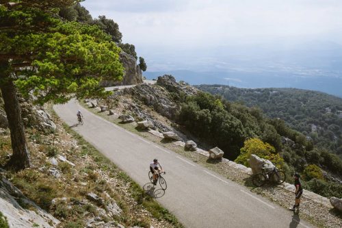 Cyclists ride on The Mare De Déu Del Mont