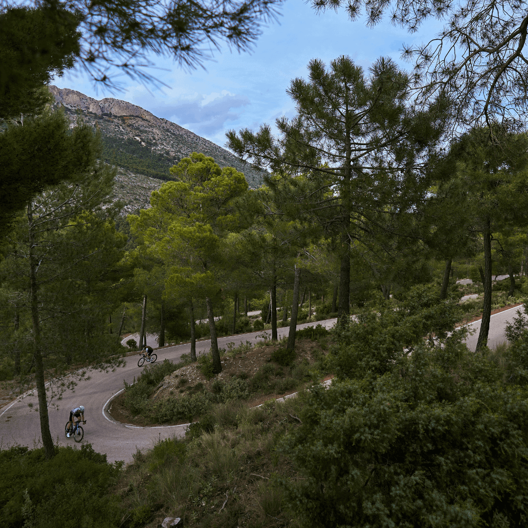 A cyclist climbing the road to the summit of the Collado Bermejo in the Sierra Espuna mountains in the Region of Murcia