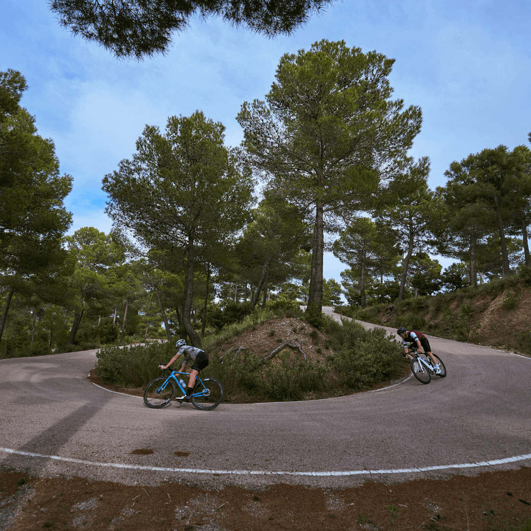 2 cyclists descending the road from the Collado Bermejo in the Sierra Espuna mountains in the Region of Murcia