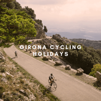 cyclist riding up a climb in girona 
