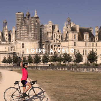 Cyclist outside a chateau in the Loire