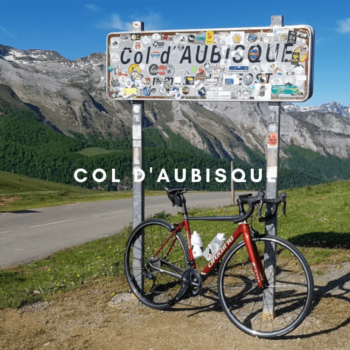 bike leaning up against the Col d'aubisque sign in the Pyrenees