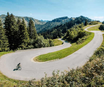 A cyclist riding up the Col de Joux Plane in the French Alps