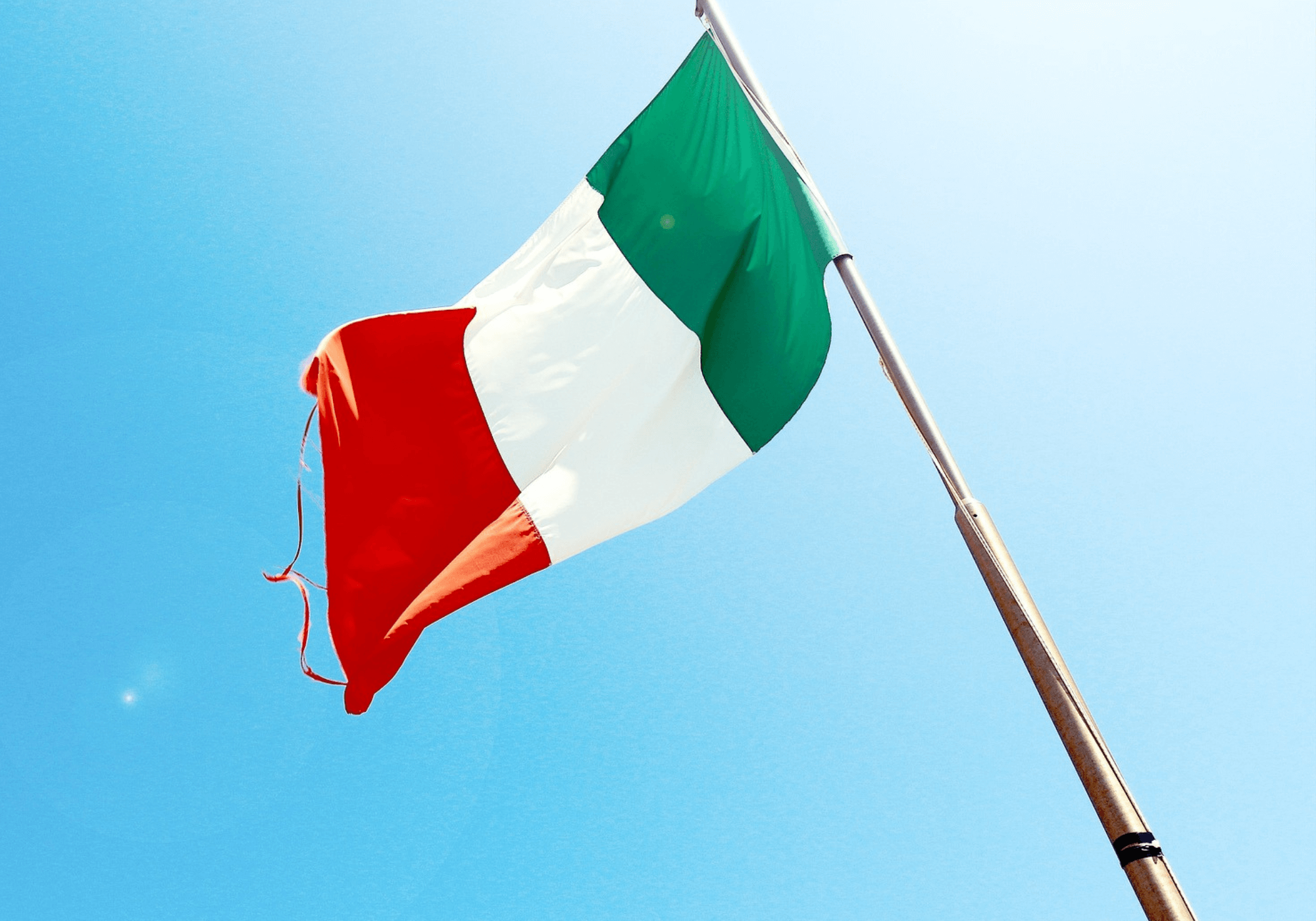 The Italian flag fluttering in blue skies