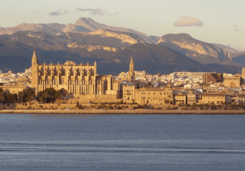 view of Palma cathedral with the mountains in the background