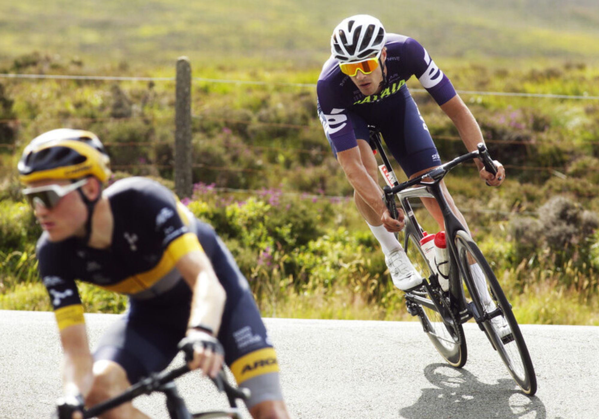 2 cyclists riding a race on the roads of the Isle of Man